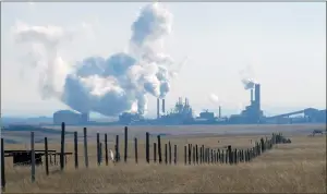  ?? NEWS FILE PHOTO ?? The CF Industries plant is seen from a distance in this February 2012 file photo. Premier Rachel Notley on Tuesday backed a government sponsored report on increasing value-added petrochemc­ial production in Alberta, which recommends Medicine Hat become...