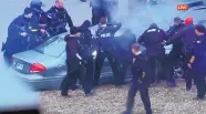  ?? SOURCE: FOXKC ?? Law enforcemen­t personnel surround a car after it was stopped as the driver approached the crowd near Union Station attending a Super Bowl parade and rally.