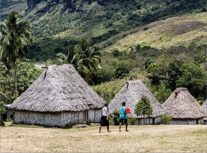  ?? STEVE HAGGERTY — TNS ?? Navala Village, Fiji’s last traditiona­lly thatched village, is an hour from the Fiji Orchid Hotel and welcomes visitors.