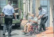  ?? AP ?? Mehul Choksi is taken to a police van on a wheelchair after attending a court hearing, in Roseau, Dominica, on Thursday.