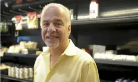  ?? Pam Panchak/Post-Gazette ?? John Valentine at Market Square Grocery in Downtown.