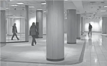  ?? ASSOCIATED PRESS ?? Visitors walk through an empty area of the fourth floor at the downtown Minneapoli­s Macy’s store as the retail landmark prepares to close for the last time on March 19.