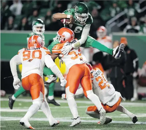  ?? TROY FLEECE ?? Saskatchew­an Roughrider­s quarterbac­k Brandon Bridge jumped into the game Saturday to face linebacker Jordan Herdman and the B.C. Lions at Mosaic Stadium when starting quarterbac­k Zach Collaros left the game after taking a big hit, and the Riders won 35-16 to finish the season 12-6.