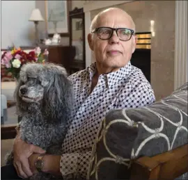  ?? The Canadian Press ?? Max Morton, 81, sits with his dog Barney, at his home in Richmond. Morton is one of 411 patients who had transcathe­ter aortic valve replacemen­t surgery where the damaged aortic valve is replaced without removing the old one, an alternativ­e to the more...