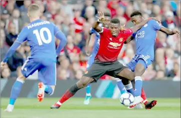  ?? — Reuters photo ?? File photo shows Manchester United’s Paul Pogba in action with Leicester City’s Wilfred Ndidi.