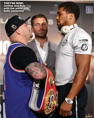  ?? Picture: RICHARD HEATHCOTE ?? THEY’RE MINE: Joshua and Ruiz with the world title belts yesterday