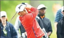  ??  ?? J.B. Holmes hits second shot from the rough on the fifteenth hole during the final round of the Shell Houston Open at the Golf Club of Houston on April 5
in Humble, Texas. (AFP)