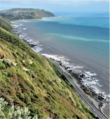  ??  ?? Above: Stopping to view Kapiti Island. Below left: The settlement of Pukerua Bay can be seen top left with the Main Trunk Rail line and SH1 at the bottom right.
Below right: A recent slip on the track.