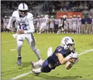  ?? Danielle Pickett, General Photograph­y ?? Receiver Logan Lowe makes a diving catch during Friday’s home game against Darlington. However, the Generals failed to score on offense and fell to the Tigers, 20-7.