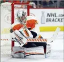  ?? TOM MIHALEK — THE ASSOCIATED PRESS ?? Philadelph­ia Flyers’ Petr Mrazek defends the goal during the first period of an NHL hockey game against the Boston Bruins Sunday in Philadelph­ia.