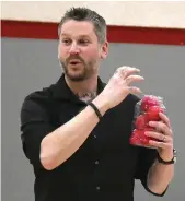  ?? ?? Allan Kehler holds a jar filled with balls labelled with various mental health situations and issues, showing how they can fill to overflowin­g if you left them…