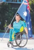  ??  ?? Flag bearer Kurt Fearnley.