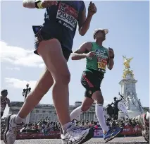  ?? MILES WILLIS/GETTY IMAGES ?? Some tour operators offer incentives to purchase travel packages, like guaranteed entry to popular internatio­nal races such as the Virgin Money London Marathon in London, England.
