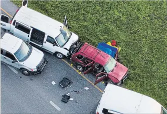  ?? JAY JANNER THE ASSOCIATED PRESS ?? The end: The vehicle, centre, in which the suspect in the bombings that terrorized Austin blew himself up.