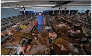  ?? (AP/David J. Phillip) ?? Bowling alley mechanic Dewayne Pellegrin cleans up Tuesday at the damaged Bowl South of Louisiana in Houma. In the aftermath of Hurricane Ida, many Louisiania­ns expressed a lingering feeling of having been hit by something far stronger than they expected.