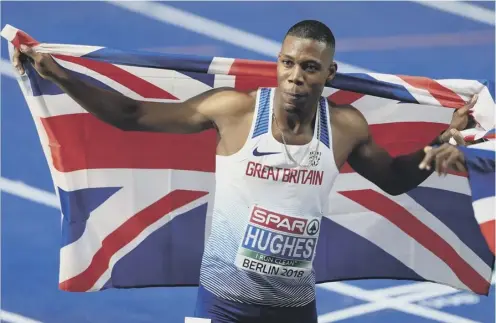  ??  ?? Zharnel Hughes celebrates after winning the 100 metres final in a Championsh­ip record of 9.95 seconds at Berlin’s Olympiasta­dion.