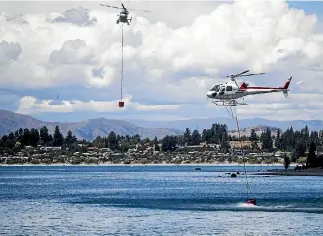  ?? PHOTO: GEORGE HEARD/STUFF ?? A Chilean tourist forfeited his drone after being convicted of flying it too close to helicopter­s fighting a large fire near Wanaka last month.