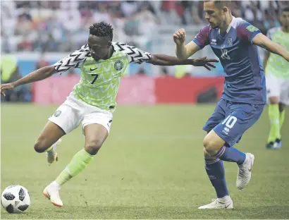  ?? Picture: AFP ?? ON TARGET. Nigeria forward Ahmed Musa, left, vies with Iceland’s midfielder Gylfi Sigurdsson during the World Cup Group D match in Volgograd yesterday.