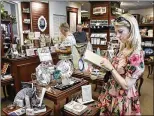  ?? MELANIE BELL / THE PALM BEACH POST ?? Linda Pratka, who was visiting the area from New York, browses through books in the gift shop at the Flagler Museum in Palm Beach.