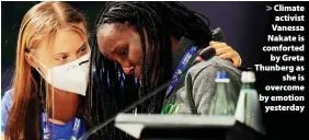  ?? ?? Climate activist Vanessa Nakate is comforted by Greta Thunberg as she is overcome by emotion yesterday