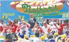  ??  ?? Nothing says Happy Birthday USA like the annual Fourth of July Nathan’s Hot Dog Eating Contest on Coney Island.