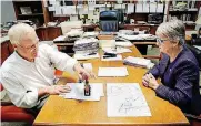  ?? [PHOTO BY JIM BECKEL, THE OKLAHOMAN] ?? City Clerk Frances Kersey, right, files the official paperwork for Oklahoma City’s Sept. 12 bond and sales tax election with Oklahoma County Election Board Secretary Doug Sanderson.