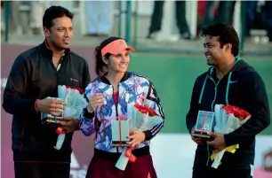  ?? — AFP file ?? India’s Mahesh Bhupathi, Sania Mirza and Leander Paes after an exhibition match.