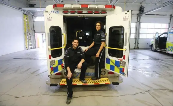 ?? STEVE RUSSELL/TORONTO STAR ?? Jonathan Andreozzi and Julie Socha were two of four paramedics who began to treat Tayyab Jafar as he lay on the pier on the Kingston waterfront.