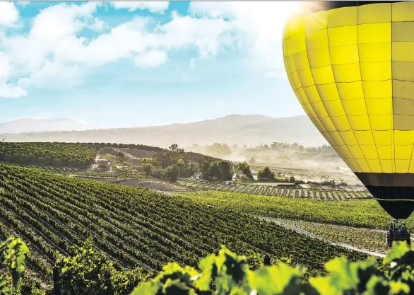  ?? VISIT TEMECULA VALLEY ?? A hot-air balloon ride is a wonderful way to see the wineries and mountains of the Temecula region, which one resident calls “a hidden gem.”