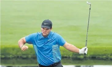  ?? AFP ?? Patrick Reed celebrates his chip-in eagle on the 15th green during the third round at Augusta National.