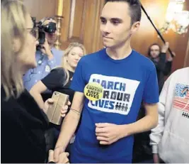  ?? CHIP SOMODEVILL­A/GETTY ?? Marjory Stoneman Douglas High School shooting survivor David Hogg joins other gun violence survivors and safety advocates for a news conference on Tuesday in Washington, D.C., to introduce legislatio­n to expand background checks for firearm sales.