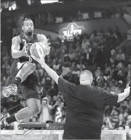  ?? Ronald Martinez Getty Images ?? DeANDRE JORDAN of the Clippers gets assistance from DJ Khaled during the slam-dunk contest Saturday night. He was eliminated in the first round.