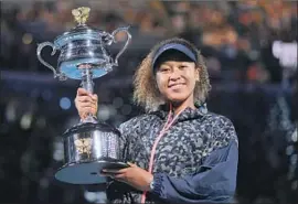  ?? Andy Brownbill Associated Press ?? NAOMI OSAKA MADE IT through a tough draw to win her fourth major title, defeating Garbine Muguruza and Serena Williams before topping Jennifer Brady.
