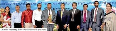  ??  ?? CBL team headed by Nalin B Karunaratn­e with the award