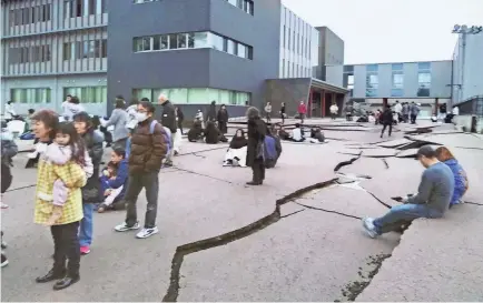  ?? KYODO NEWS VIA AP ?? The ground in Wajima, Ishikawa prefecture, Japan, is cracked on Monday, following an earthquake. Japan issued tsunami alerts Monday after a series of strong quakes in the Sea of Japan.