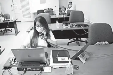  ?? LYNNE SLADKY/AP ?? Maria Fernanda works on contact tracing last week at the Florida Department of Health in Miami-Dade County.