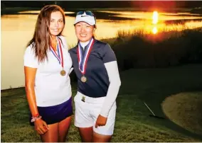  ??  ?? As the sun set on the Old Waverly Golf Club on Tuesday, Alexa Pano, left, and Jiarui Jin captured medalist honors after they tied in stroke play at the 2019 U.S. Women’s Amateur. (Photo by Steven Gibbons, USGA, for Starkville Daily News)