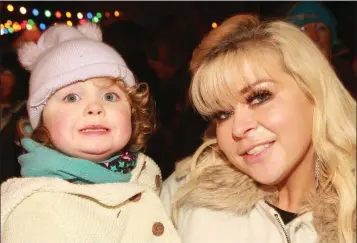  ??  ?? Cassy O’Leary with her daughter Freyia at the switching on of the Christmas lights in Kilmuckrid­ge.