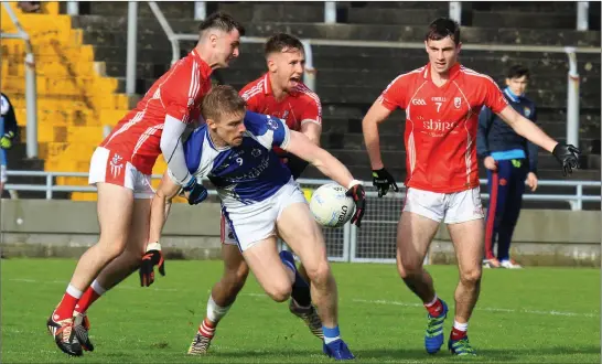  ??  ?? Tommy Walsh, Kerins O’Rahillys, is well marked by East Kerry’s Dan O’Brien, Dan O’Donoghue and Shane Cronin during their County SFC quarter-final in Austin Stack Park, Tralee last Saturday. Photo by Domnick Walsh