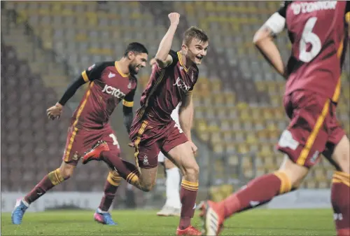  ?? PICTURE: BRUCE ROLLINSON ?? FIGHTING FOR THE CAUSE: George Miller celebrates scoring Bradford’s fourth goal in their dramtaic FA Cup defeat to Peterborou­gh United.