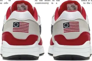  ?? NIKE VIA ASSOCIATED PRESS ?? CONTROVERS­IAL SNEAKERS: Nike is pulling its Air Max 1 Quick Strike Fourth of July shoes, which have an early U.S. flag on them. At top, Colin Kaepernick’s Nike advertisem­ent is seen on top of a building in San Francisco last year. Kaepernick objected to the use of the Colonial-era flag.