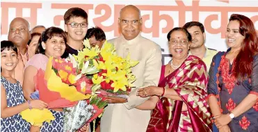  ??  ?? Ram Nath Kovind along with his wife Savita accepting greetings on being elected as the 14th President of India, in New Delhi on Thursday. — PTI