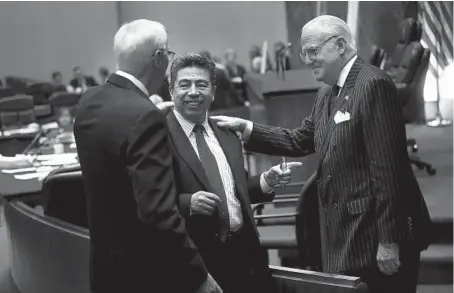  ?? NANCY STONE/CHICAGO TRIBUNE ?? Aldermen Richard Mell, 33rd, Daniel Solis, 25th and Edward Burke, 14th, chat before hearings in the Chicago City Council on May 28, 2013.