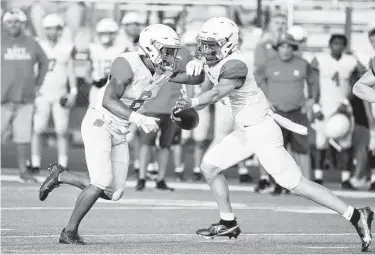  ?? Karen Warren / Staff photograph­er ?? Katy quarterbac­k Caleb Koger and running back Seth Davis, competing in a scrimmage with Klein Collins on Thursday, will try to lead the Tigers to a 10th state championsh­ip this season.