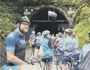  ?? PICTURE BY TOM WOOLLARD ?? TUNNEL VISION: Cyclists at the entrance of Queensbury tunnel