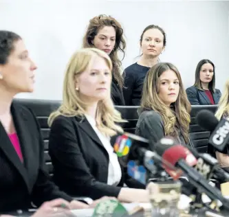  ?? CHRISTOPHE­R KATSAROV/THE CANADIAN PRESS ?? Lawyers Alexi Wood (left) and Tatha Swann (second from left) and plaintiffs Hannah Miller, Patricia Fagan, Diana Bentley and Kristin Booth attend a press conference after filing lawsuits alleging sexual harassment by Soulpepper Theatre Company director...