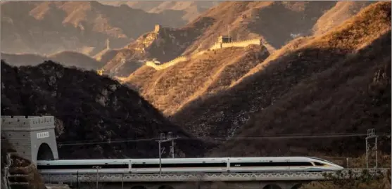  ??  ?? The Beijing-Zhangjiako­u High-speed Railway went into service on Dec 30, 2019. The Fuxing bullet train crosses the ancient Juyong Pass of the Great Wall, where tradition blends with modernity.