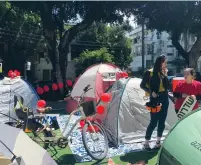  ?? (Anna Ahronheim) ?? RESIDENTS OF GAZA STRIP periphery communitie­s protest the security situation by pitching tents on Tel Aviv’s Rothschild Boulevard on Thursday.