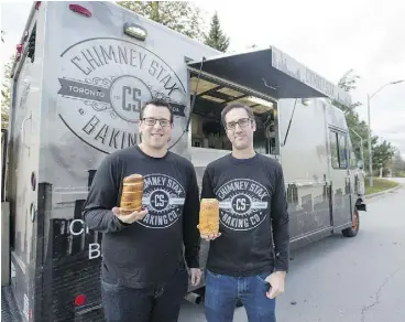  ?? LAURA PEDERSEN / NATIONAL POST ?? Chimney Stax Baking Co. founders Matt Lindzon, left, and Zach Fiksel are taking their rotisserie-baked bread concept beyond food trucks into kiosks in malls across Ontario.