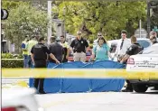  ?? ANDRES LEIVA / THE PALM BEACH POST ?? Delray Beach police officers and crime scene technician­s investigat­e the site of a fatal train incident that left one person dead at the train tracks near Southeast Fourth Street on Sunday.
